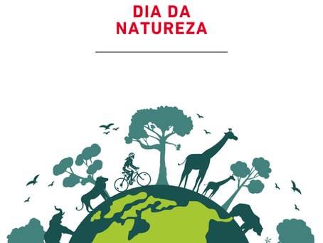 Post da Bicicletas Monark SA de Dia da Natureza com silhuetas de animais, árvores e ciclista sobre o planeta Terra em verde.
