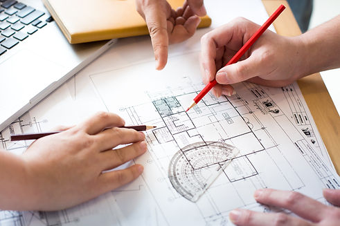 architects-discussing-table-with-blueprint-closeup-hands-project-print.jpg
