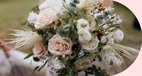 A bride's bouquet with soft pink & white roses, with greenry and eucalyptus.