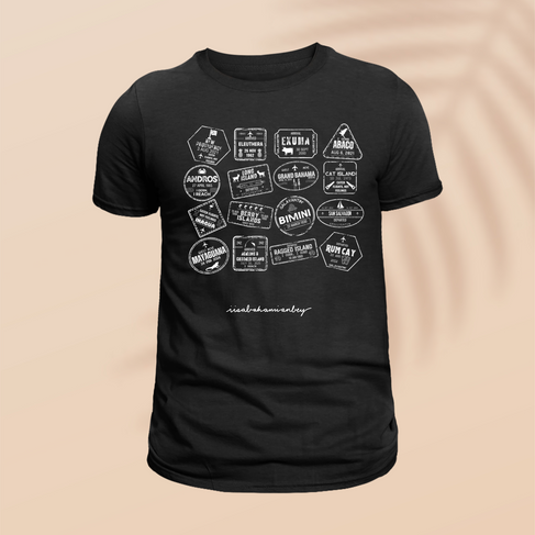 Travel stamps from various islands, featuring names, dates, and symbols on a black shirt