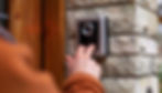 A Senior uses a smart doorbell to see who is at his door