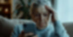 A senior woman overwhelmed by her smartphone