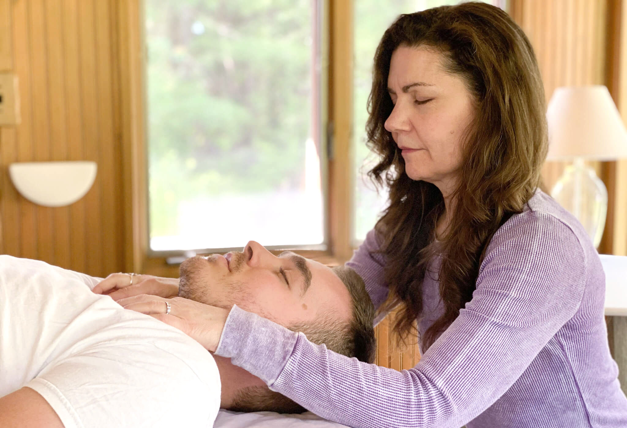 Hands on somatic healing with expert craniosacral therapist Pamela Anderson in Medfield, MA.  gentle, hands-on somatic healing modality works directly with the body's own wisdom — quieting the central nervous system, releasing deeply held tension, trauma, and emotional pain, and restoring a profound sense of ease and settledness. Used for trauma, tongue ties, chronic pain, muscle pain, post-surgical support and healing, headaches, migraines, jaw tension, nervous system dysregulation.