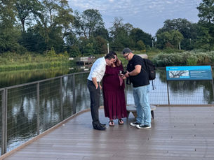 Omar Landaverry, photographer, guides their clients through a photography session. 