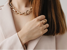 Minimalist gold and pearl jewelry styled elegantly to reflect quiet luxury and timeless design
