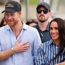 Prince Harry and Meghan Markle with King Charles at a formal royal event