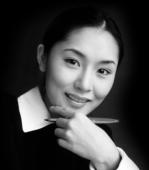 Smiling business woman with pen