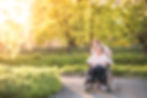 Elderly grandmother in wheelchair with g