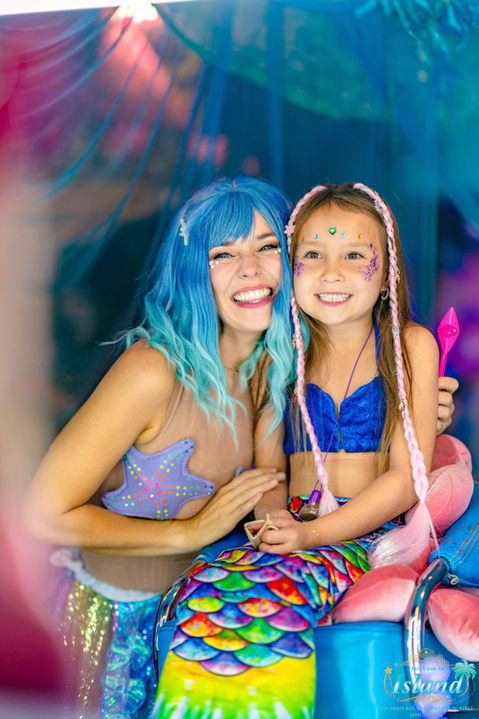 Mermaid hairstyling and shimmer makeup for children
