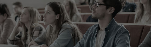 Adult learners taking notes during a face-to-face education and training course.