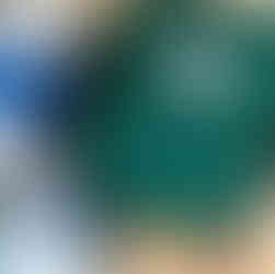 Green first aid kit bag with medical supplies, illustrating essential workplace first aid equipment.