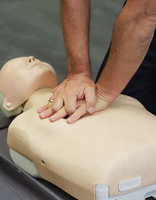 Hands on CPR practice during a DTMK Training Services first aid course.