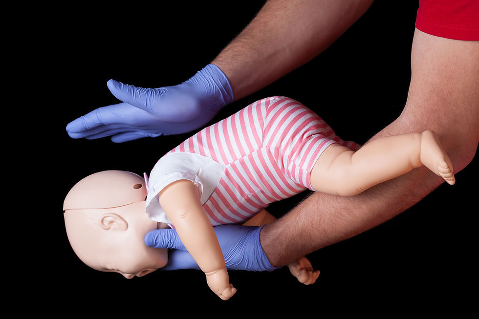 First aid demonstration of back blows for a choking infant using a baby manikin
