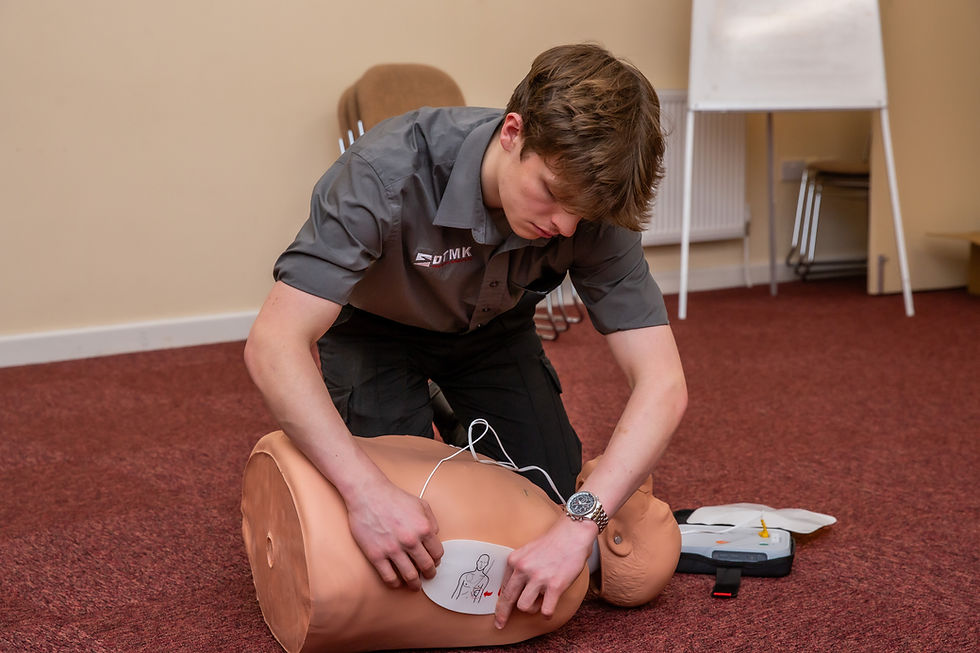 Learner practising CPR and AED use during workplace first aid training
