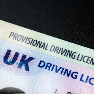 UK provisional driving licence close up showing learner driver entitlement and a Full UK driving Licence