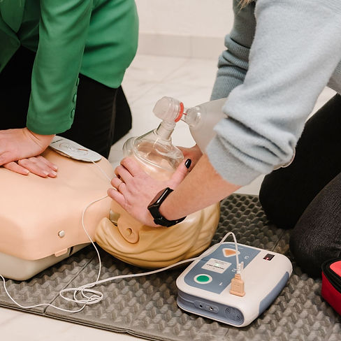 Learner practising CPR, bag-valve-mask ventilation and AED use during clinical first aid training