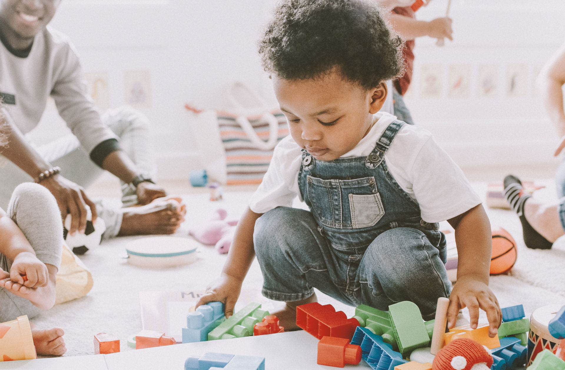 Young child playing independently in an early-years setting