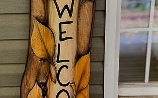 Chainsaw Carved welcome sign with bluebird