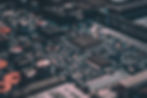 Detailed close-up of a computer circuit board, highlighting the global supply chain in technology and manufacturing