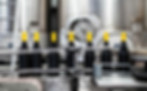 Bottling line in a modern factory filling wine bottles, illustrating automated production and global beverage trade