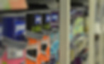 Close-up of colorful paint cans on a store shelf, showcasing international trade in construction and home improvement