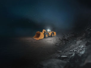 A yellow bulldozer with headlights on sits on rocky terrain under a starry night sky, creating a serene and solitary atmosphere.