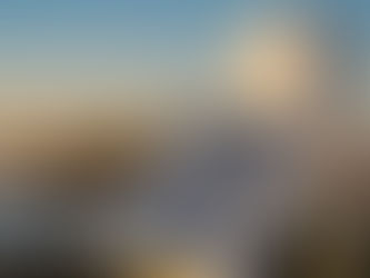 Solar-powered GNSS reference station mounted on a pole at sunset — the physical infrastructure behind RTK corrections delivery for autonomous fleet positioning