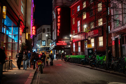 Neon nights in Soho – The glow of signs and the blur of footsteps bring London’s nightlife to life. - Thomas Oberdorfer Photography