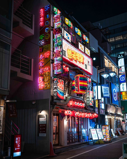 a store with vibrant neon colored signs - Thomas Oberdorfer Photography