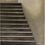 Thumbnail: brown stairs with sunlight shining on the right wall no the stairs when looking from bottom