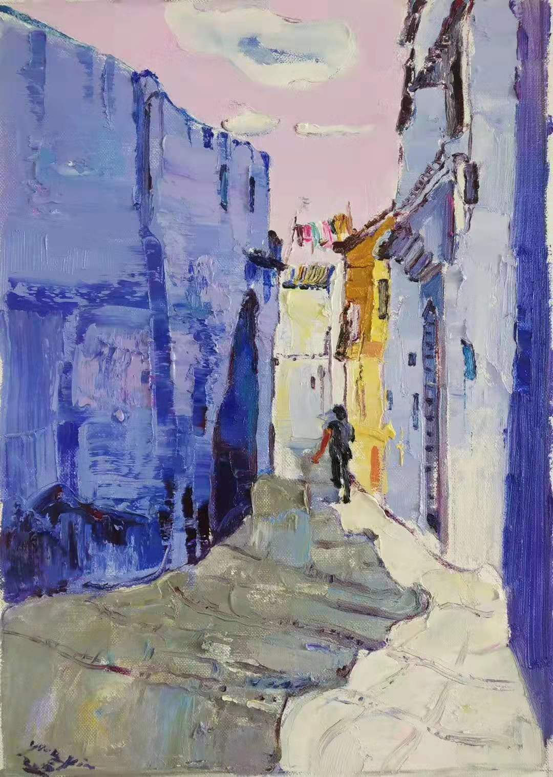 narrow alley blue building on left light purple building on right and person in distance