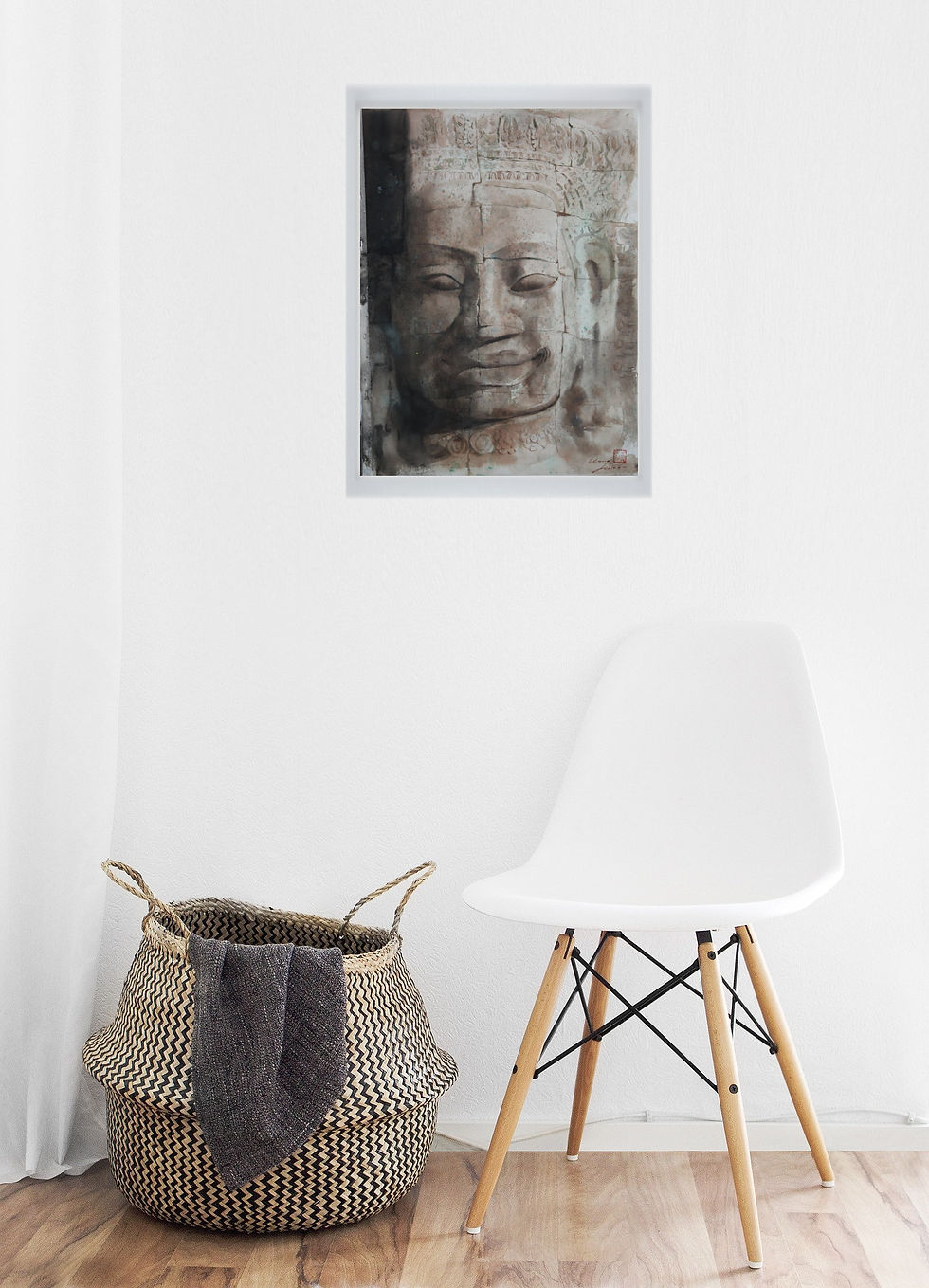 Smiling face of ancient sand colored stone asian figure with slightly big nose and lips