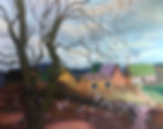 looking through budding tree to far off homes with different colored roofs