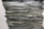 Strips of different lengths similar widths and shades of black to white color are stacked