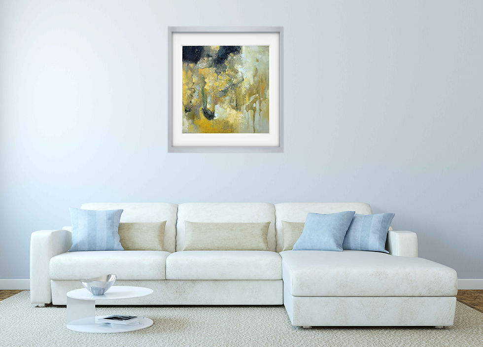 painting on light gray wall above large L shaped white sofa round coffee table in front