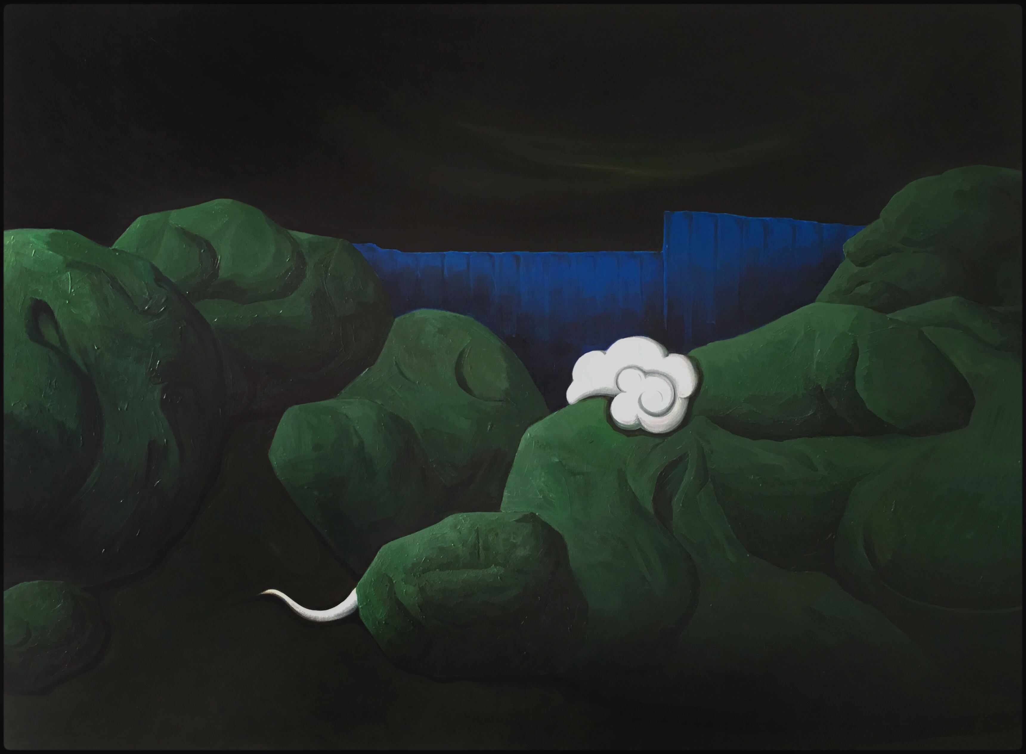 green stones look like hills small white cloud pass over one and blue board in background