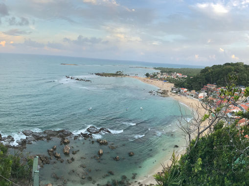 Vista do Farol da Ilha para a Primeira Praia em Morro de São Paulo com mar cristalino.