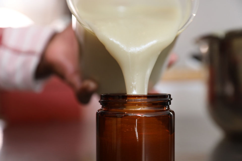 Balm filled into glass jar
