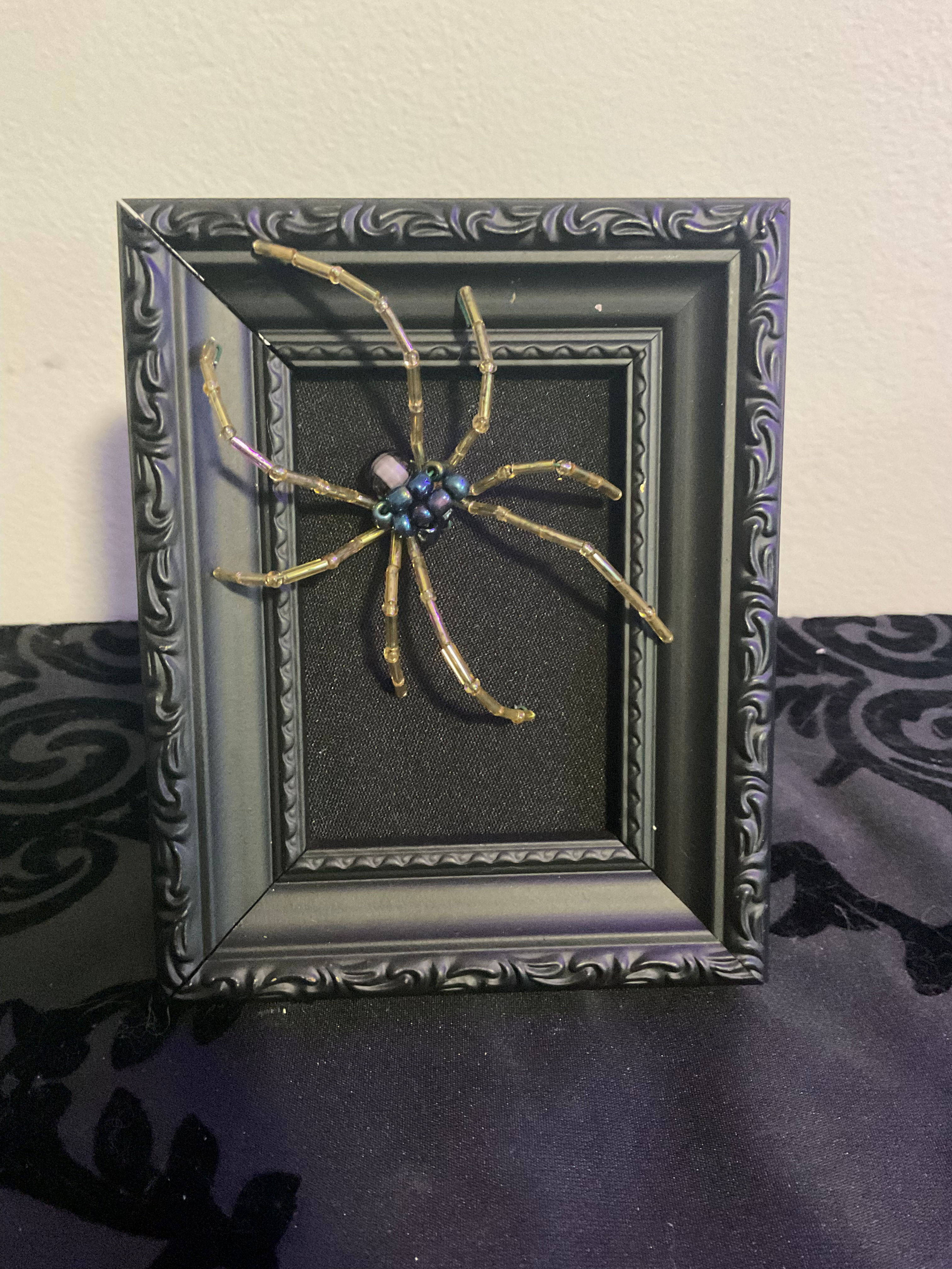 Gold Spider on Black Frame