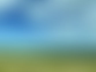 landscape photo of rolling hills with blue sky and clouds above