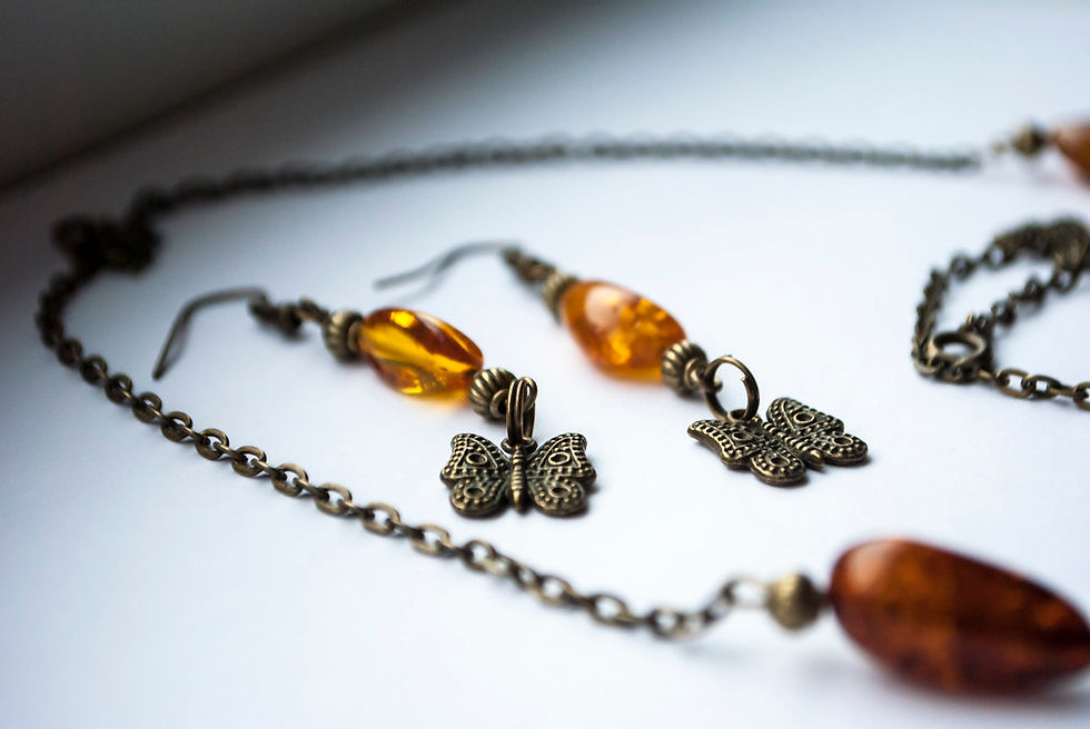 Handmade jewelry with amber and silver butterflies.