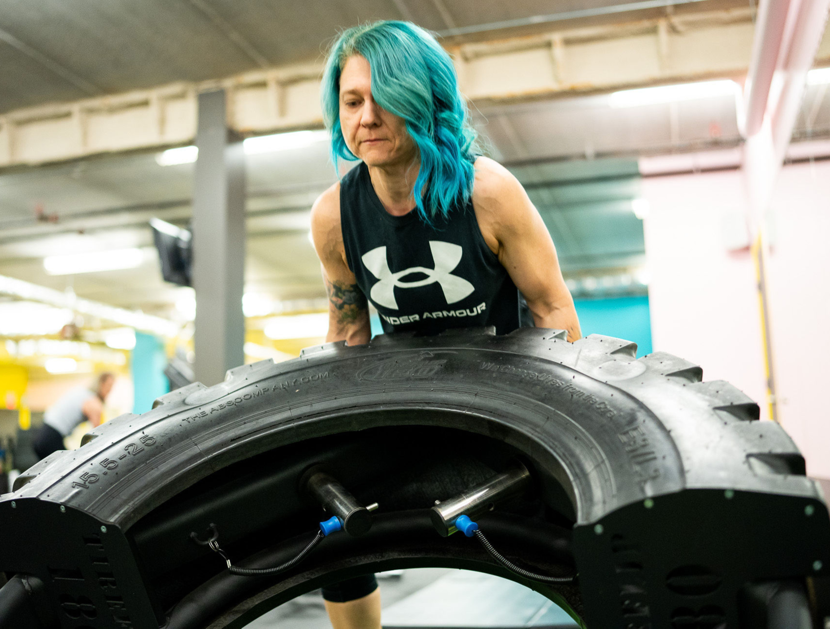 Woman doing tire flips