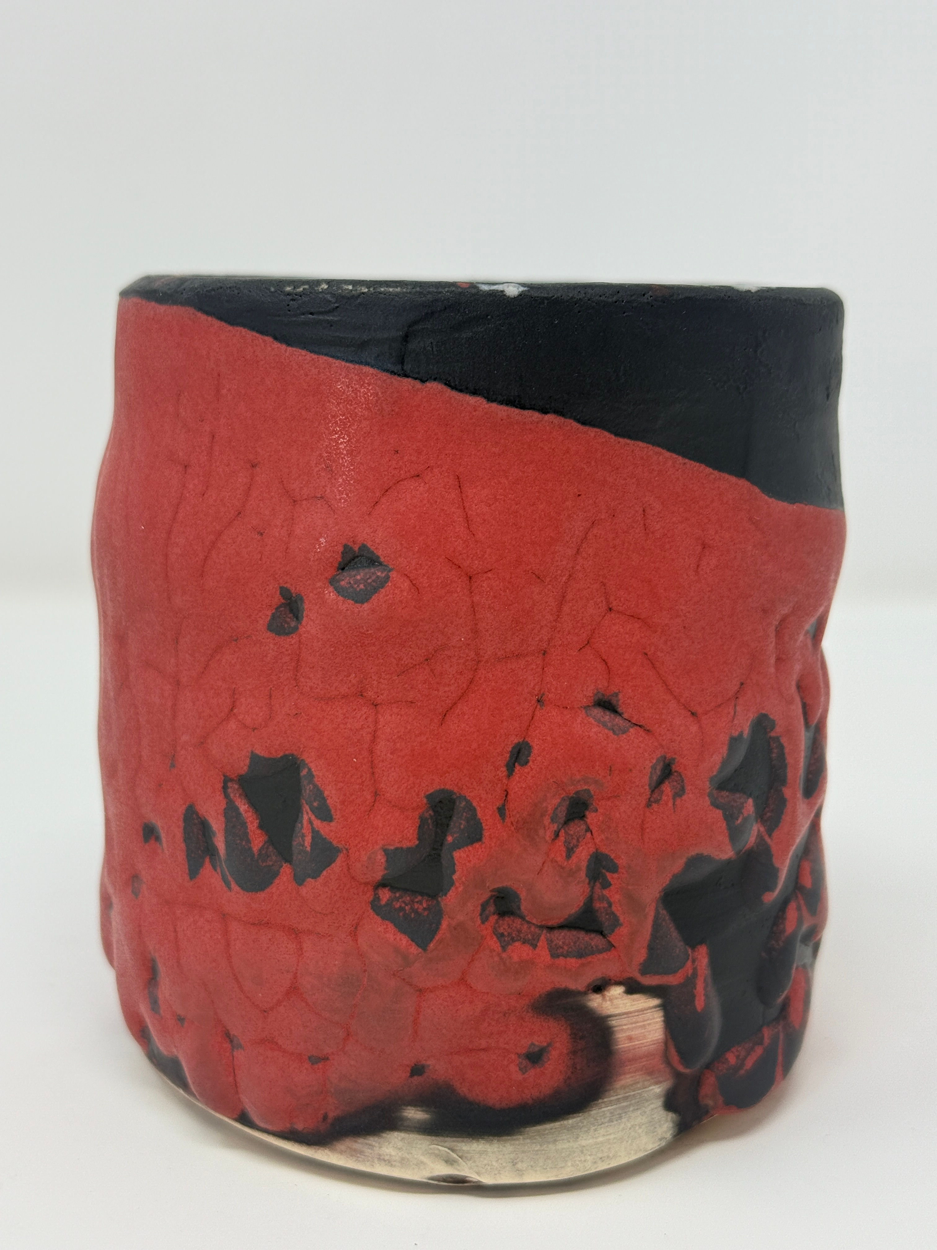 Crackled Red glaze on black medium sized cylinder
