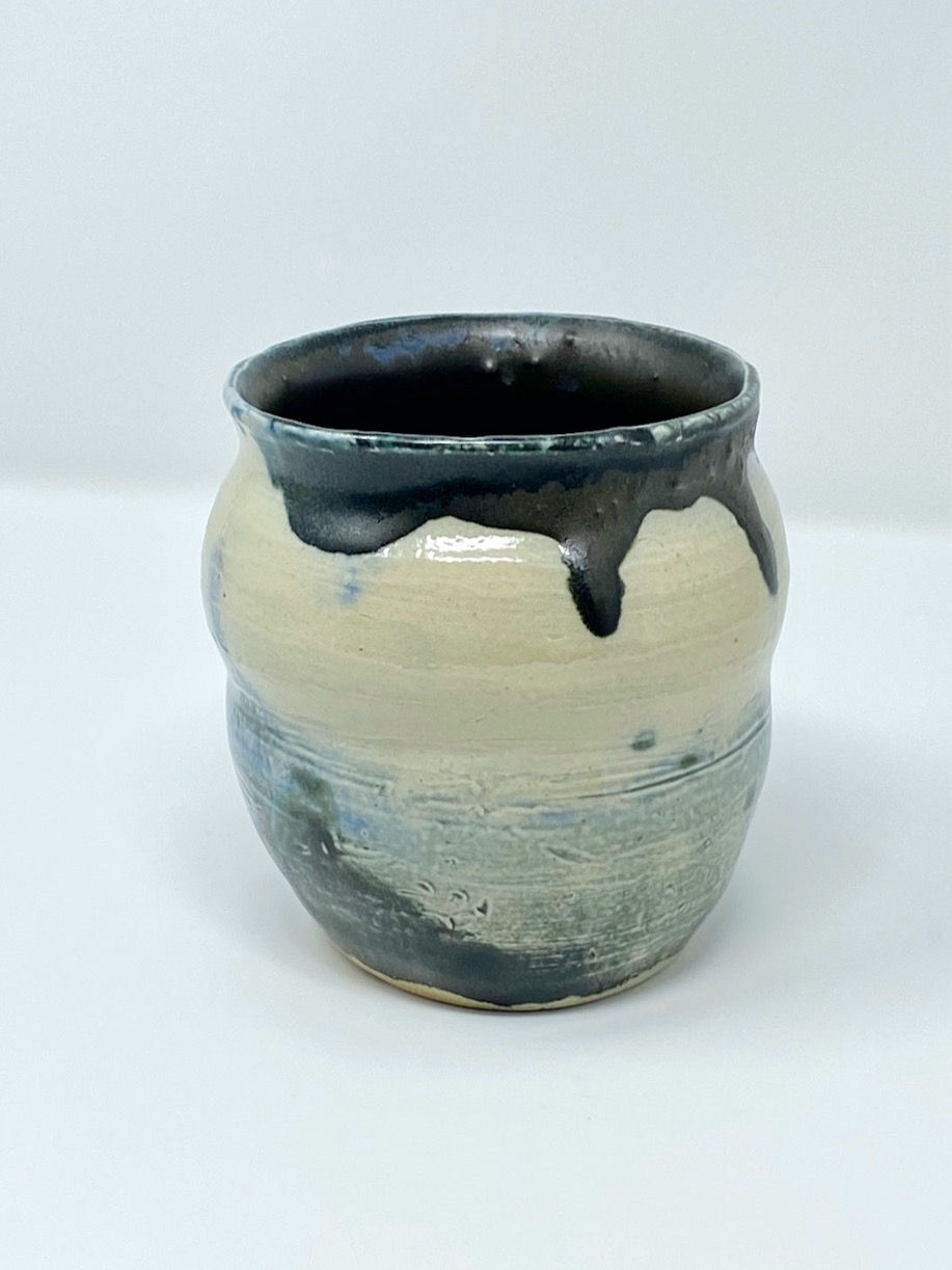 Thumbnail: Egg shaped vase with cinched waist and neck.  In blue, black, and white.