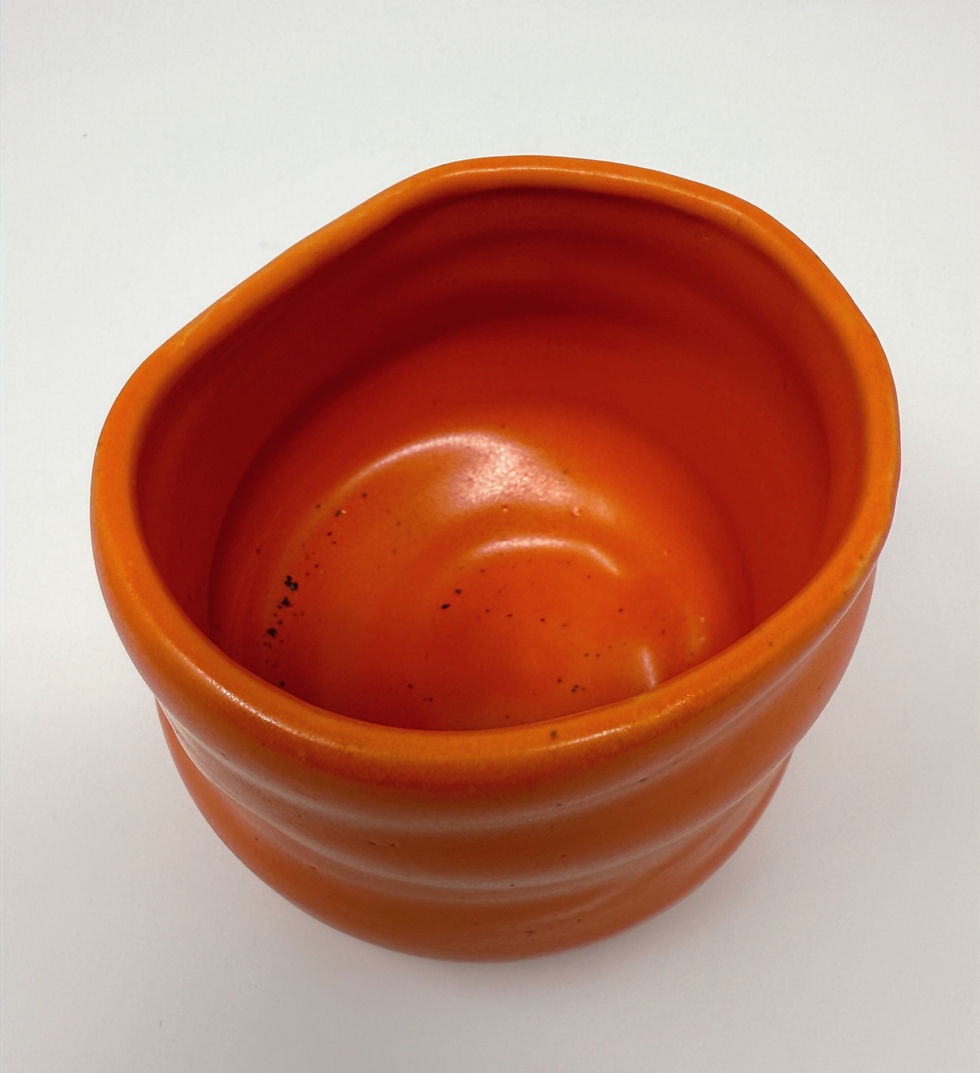 Thumbnail: misshapen narrow bowl in orange