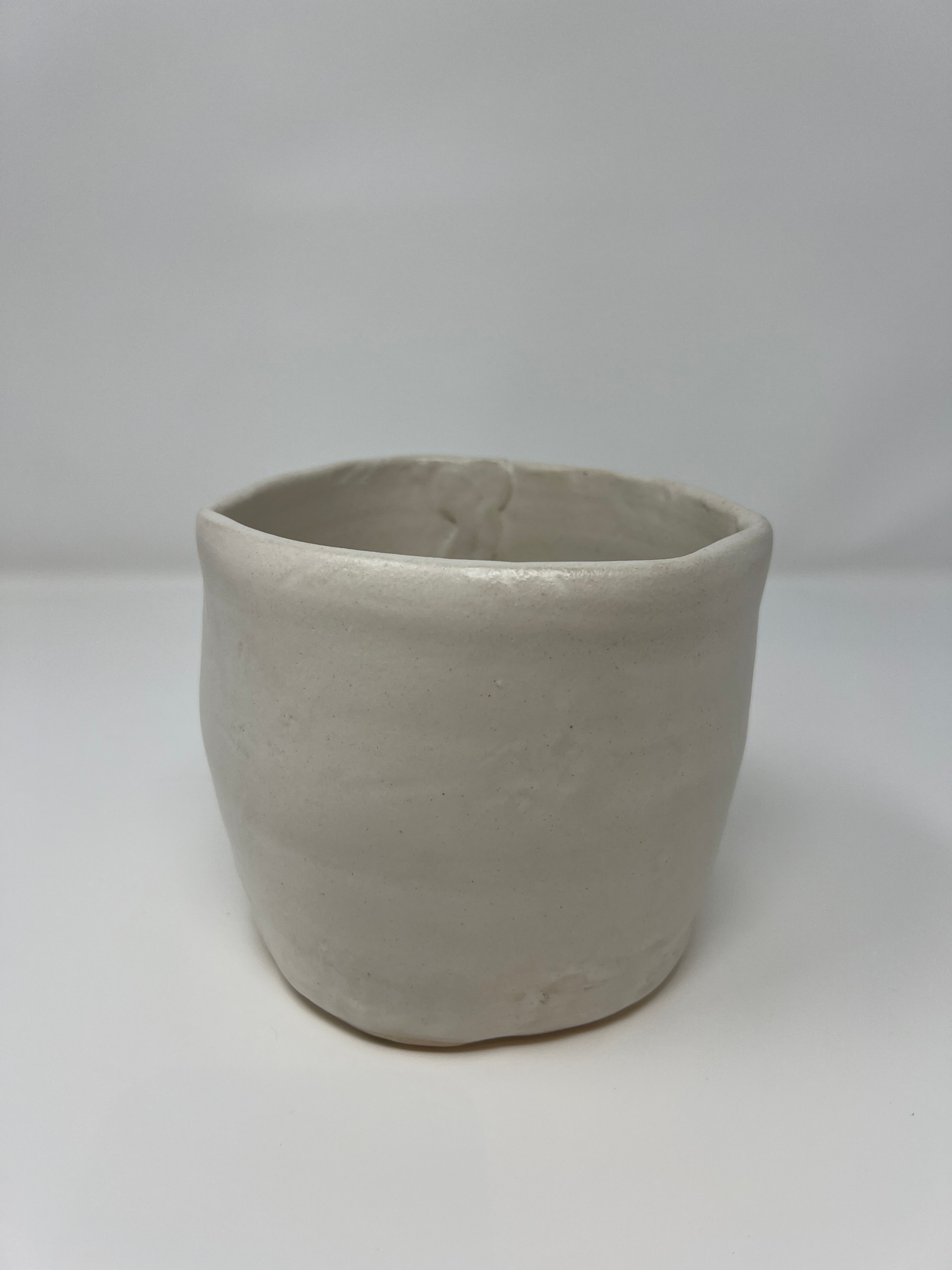 Large white cylindrical pot