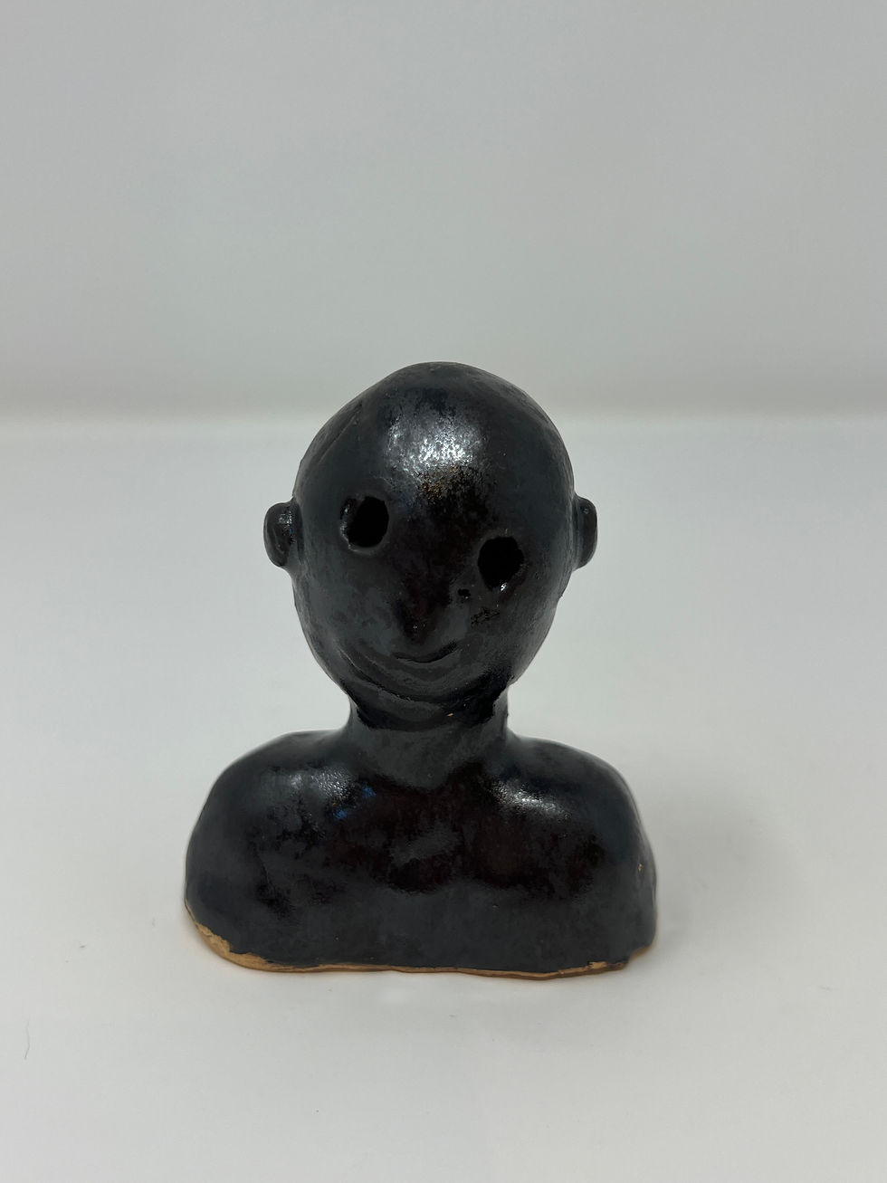Small male sculpture from shoulder to top of head in black