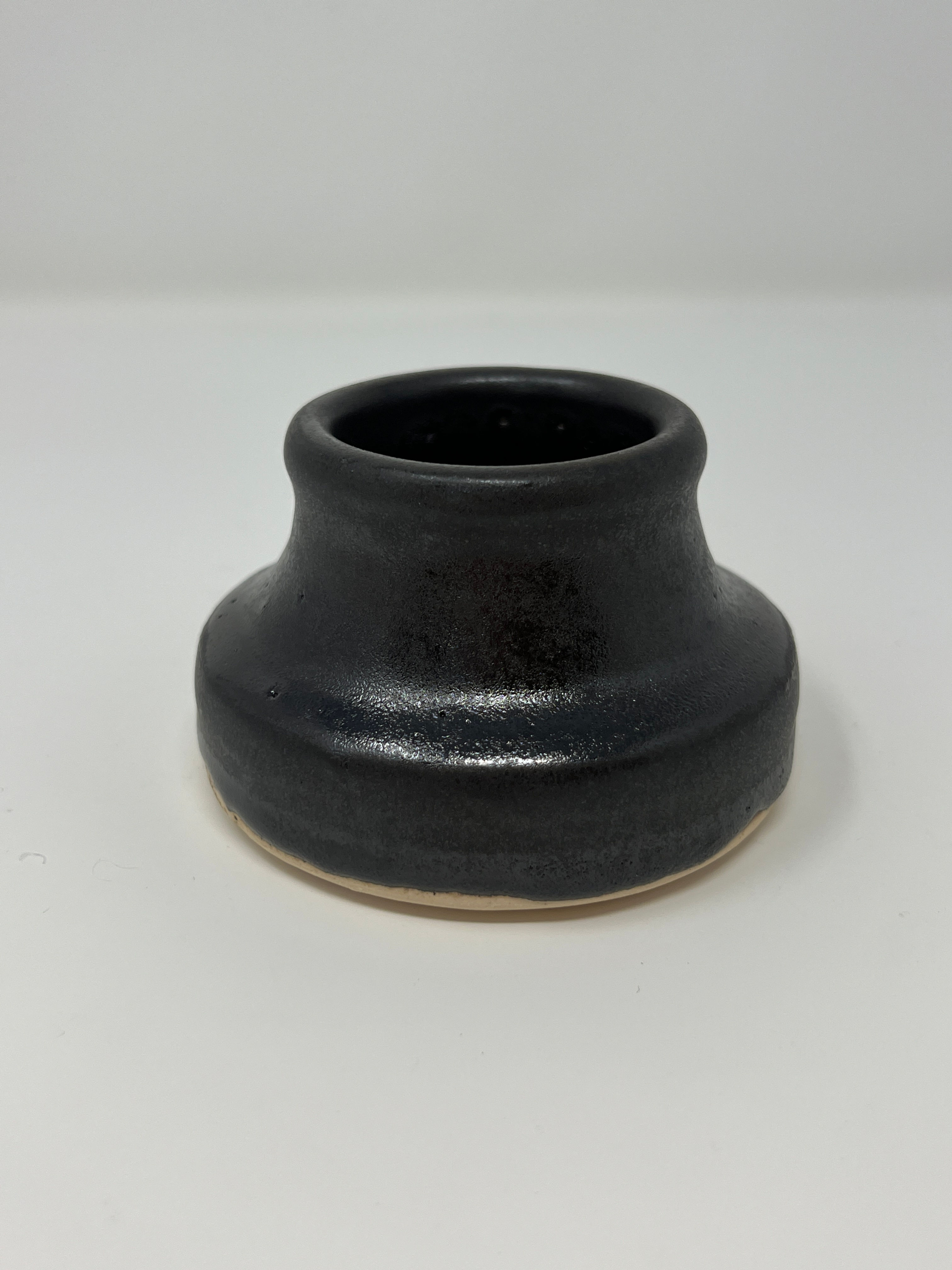 Inkwell shaped object in black