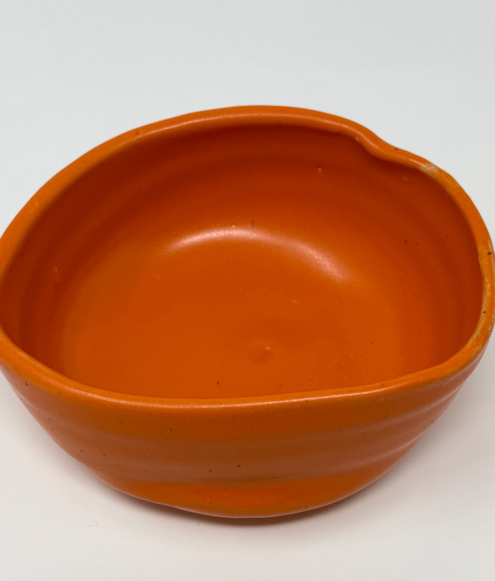 Thumbnail: shallow misshapen bowl in orange