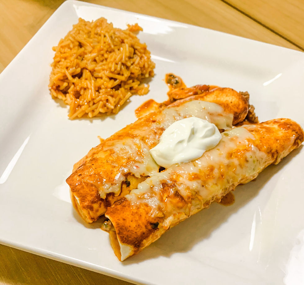 Flour tortilla enchiladas filled with ground beef, peppers and spinach. Topped with sour cream and served with spanish rice.